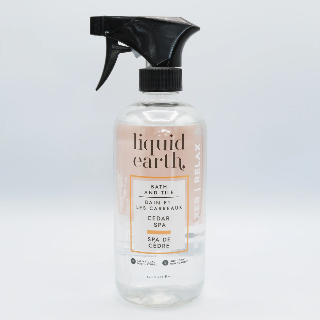 bath and tile cleaner cedar spa product image in glass bottle with black spray pump against white backdrop
