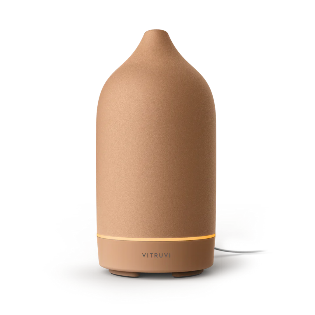 Terracotta brown stone diffuser against white background