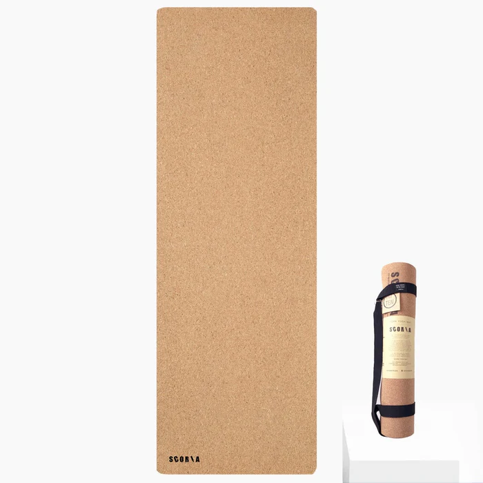 cork yoga mat on white background with image snip of packaging