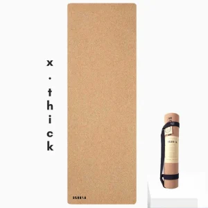 cork yoga mat against white background and marketing feature explaining extra thickness