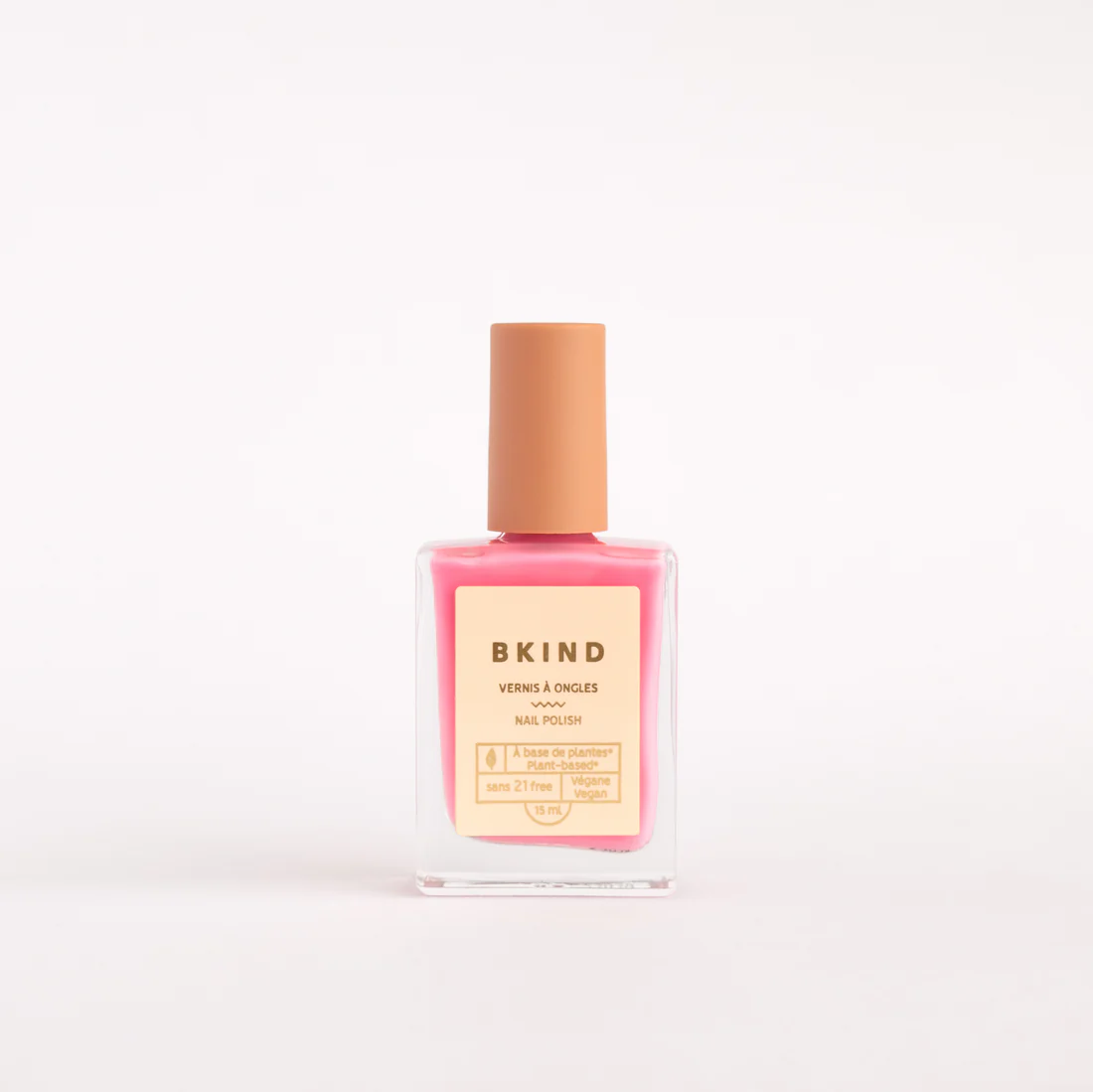 gemini nail polish is a bright pink colour in a square nail polish container against a white background
