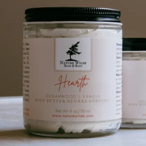 4 oz jar containing whipped butter with Nature Wilde logo and product description of hearth body butter