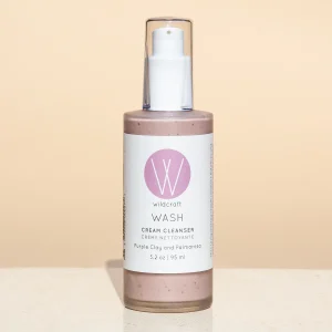 wash cream cleanser by wildcraft product image against pink backdrop