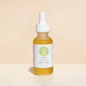 refine face serum by wildcraft product image against pink backdrop