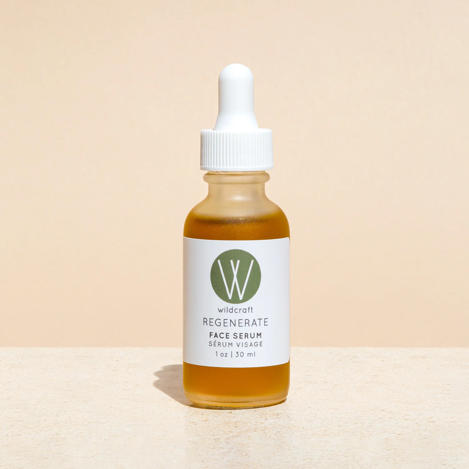 regenerate face serum by wildcraft product image against pink background
