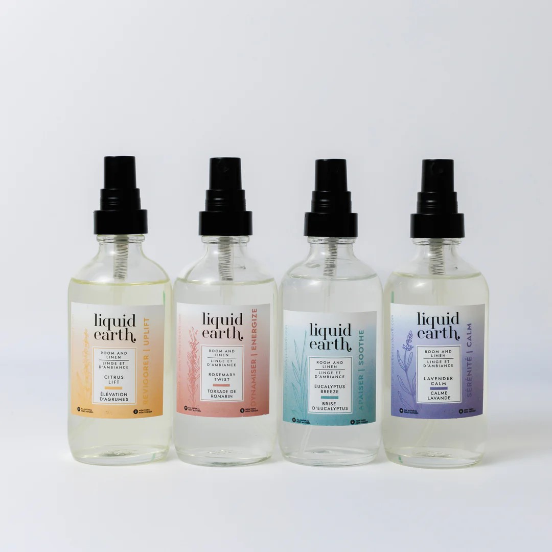 room and linen spray group shot of product in small clear spray bottle against white backdrop