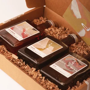 discovery gift box with 3 varieties of maple syrup in a brown craft gift box
