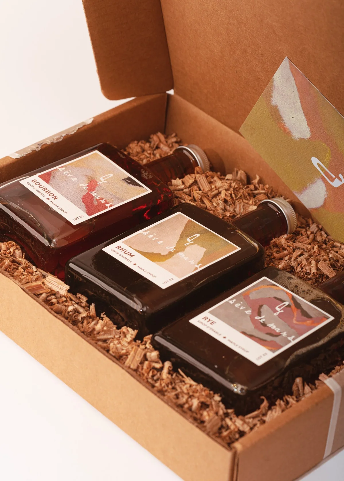 discovery gift box with 3 varieties of maple syrup in a brown craft gift box